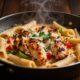 Skillet of creamy Cajun pasta topped with chicken, peppers, parsley, and Parmesan.